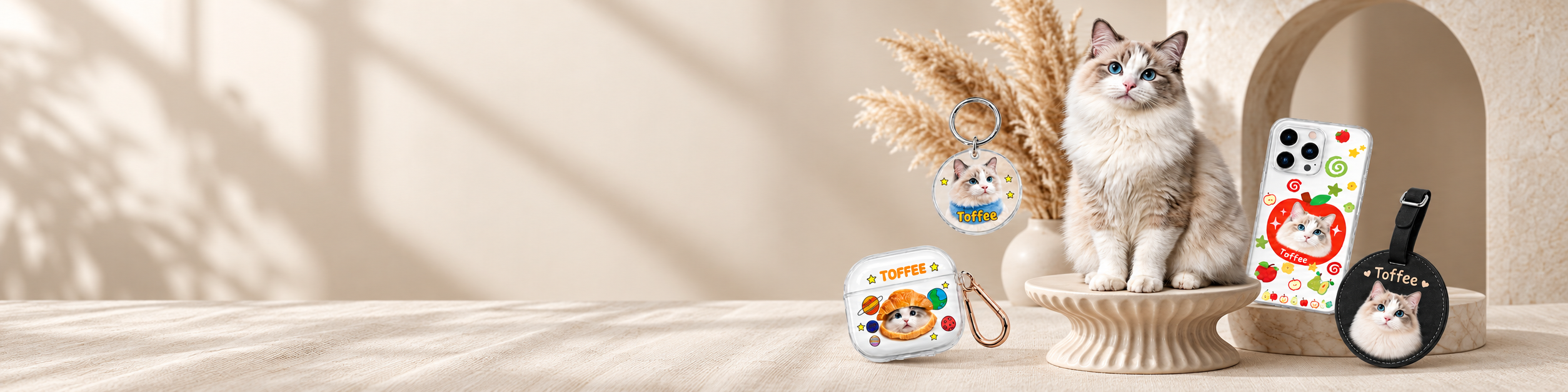 Toffee the cat with a custom pet keychain, AirPods case, phone case, and luggage tag
